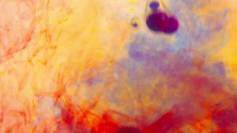 red, yellow, and blue food coloring mixed with oil underwater