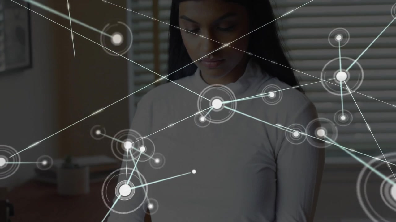 Woman tapping tablet screen and generating data network overlaying home office for tech analysis