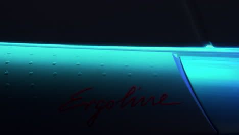 close up of bright blue tanning sunbed and lid being opened and closed