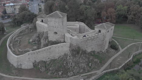 Preserved-and-reconstructed-castle-next-to-the-park-people-walk-inside