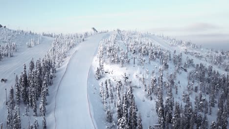 drone shot empty ski resort and slopes in beautiful mountain range