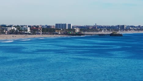 still aerial drone shot of santa monica beach and santa monica pier