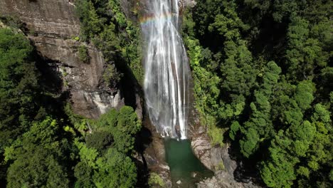 aerial view of amazing waterfall forest and rocky mountain, westland, new zealand