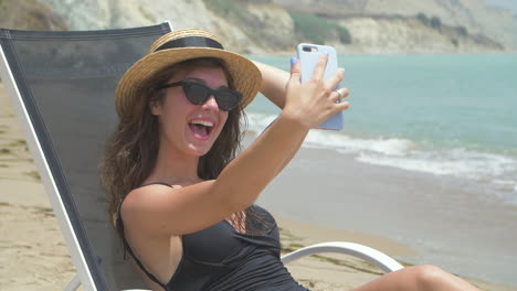 woman taking a selfie on the beach