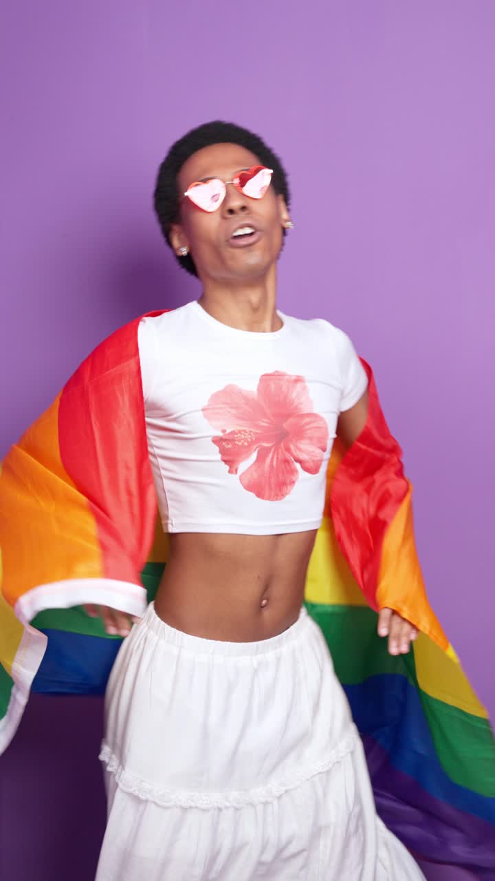 Photos of a person holding a pride flag