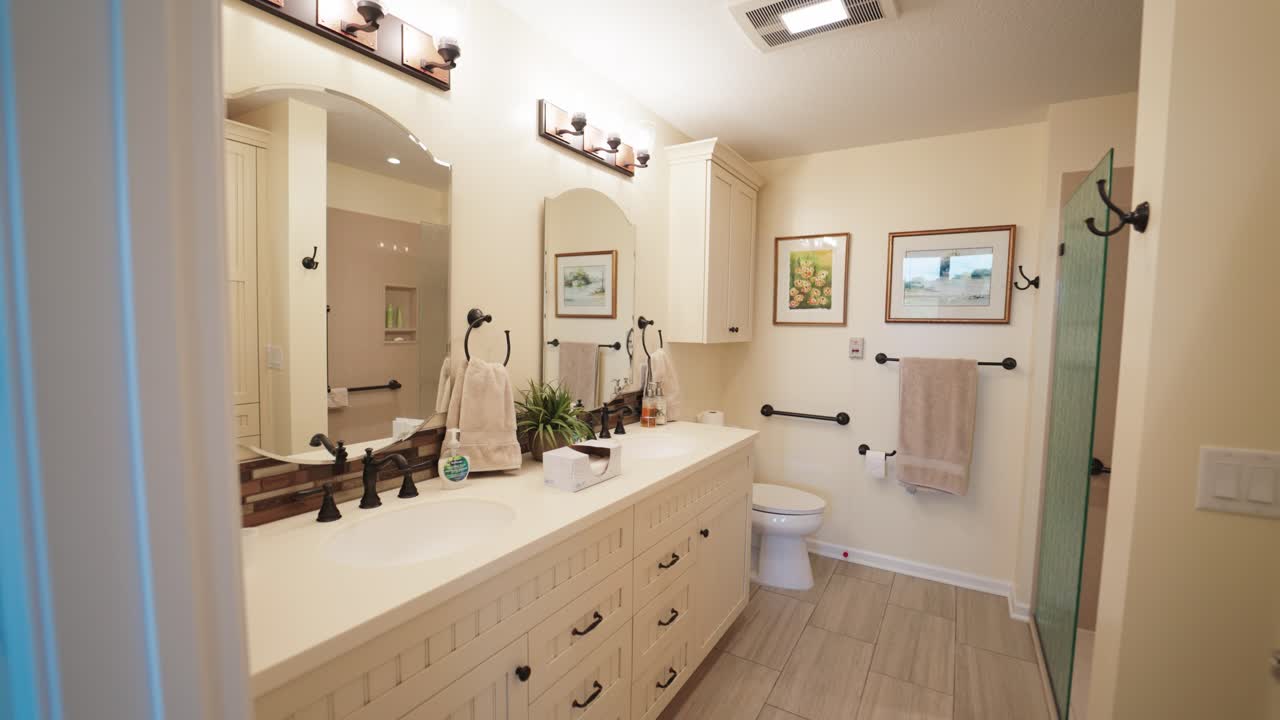 Slow motion gimbal footage of an art collectors condo - showcasing African art collection