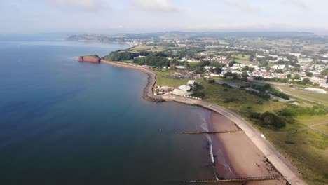 Aerial-Over-Dawlish-Warren-Beach-With-Town-In-Distance