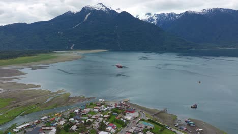 aerial view over hualaihué, a chilean commune located in palena province, los lagos region beside fjord waterway