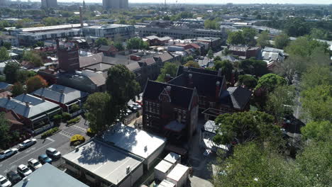 original school facade under construction revealing melbourne cbd and commission towers