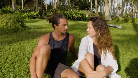 young couple sitting on the grass