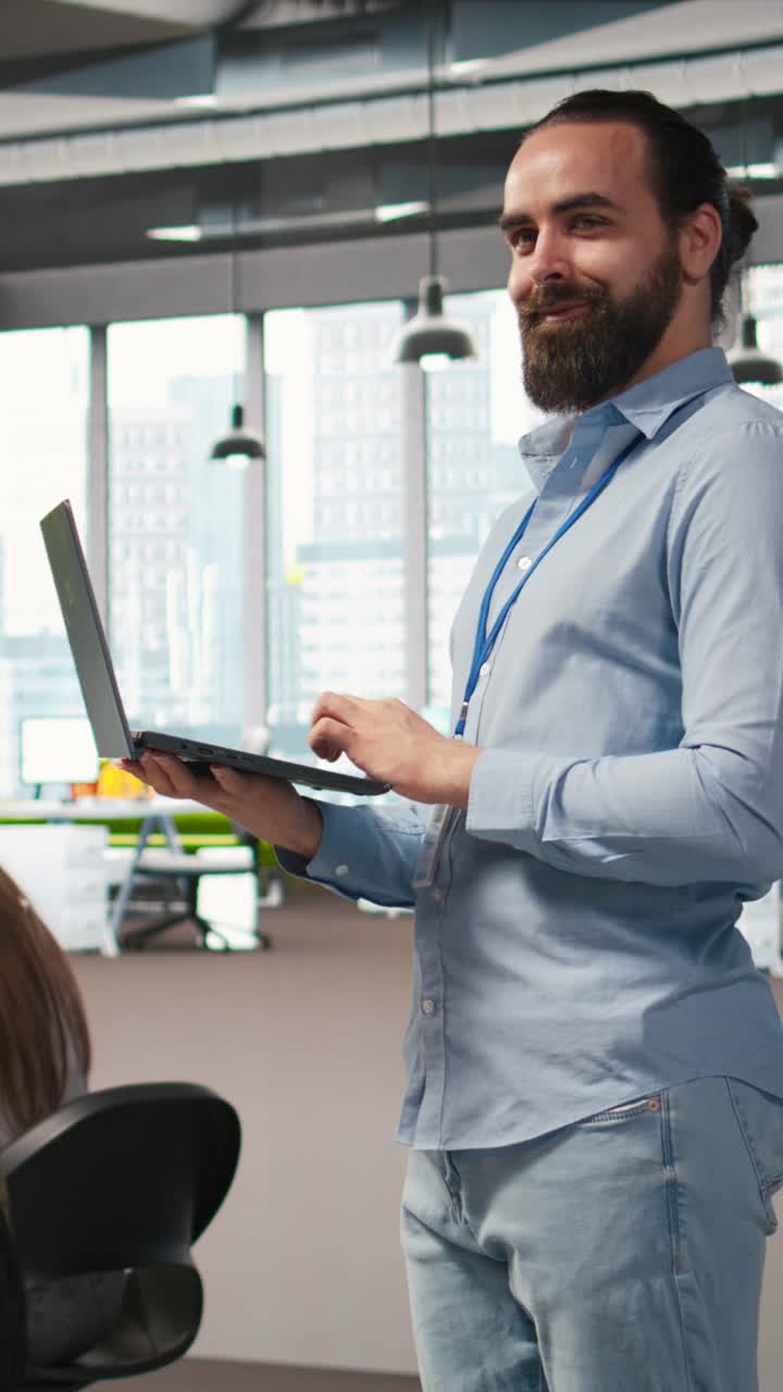 Vertical video Jolly programmer coding AI algorithms on laptop to debug software issues