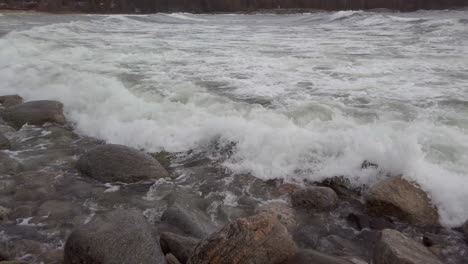 waves washing over rocks panning left