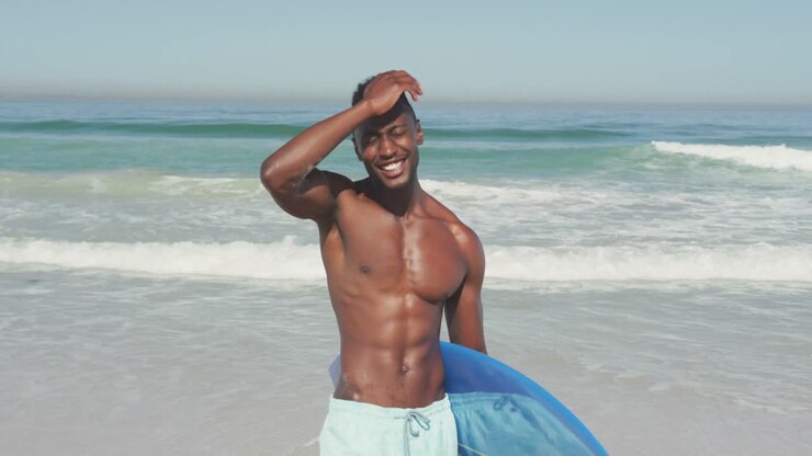 African American man with a surfboard