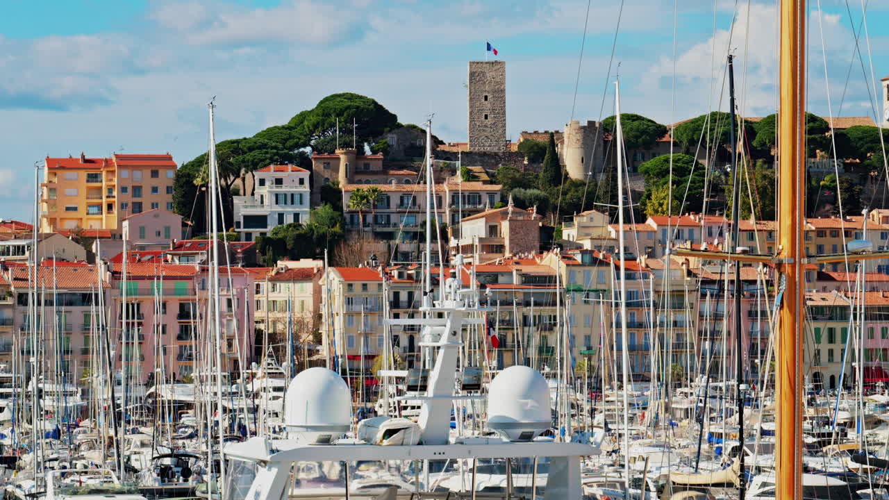 Boats docked in the Vieux-Port the mountains on the background in Cannes, France