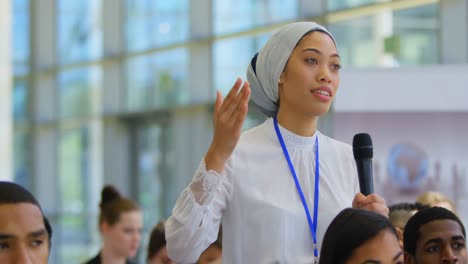 businesswoman interacting with the speaker in the business seminar 4k