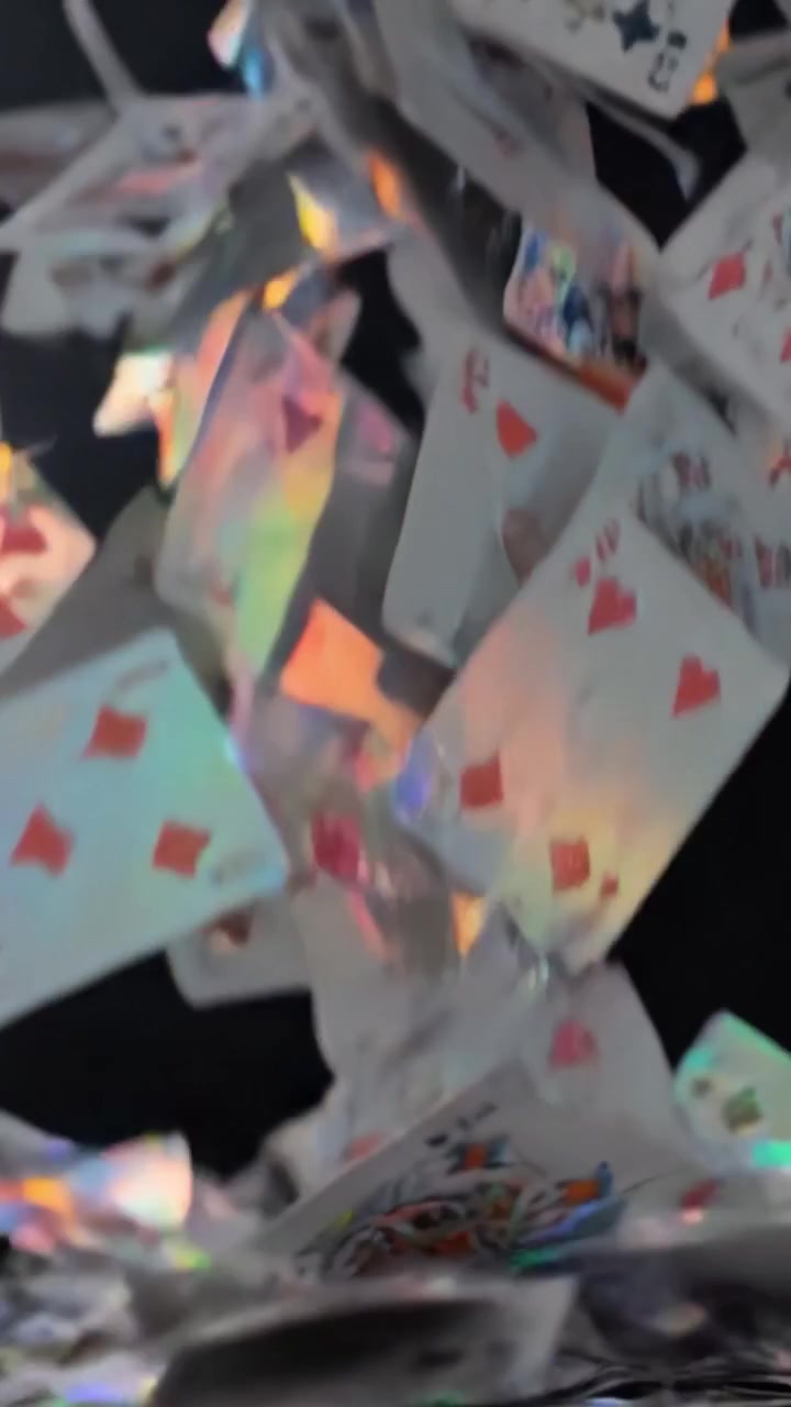 A Dramatic Scene of Playing Cards Falling Through the Air, Capturing the Excitement and Anticipation of a Game in a Dark, Mysterious Setting