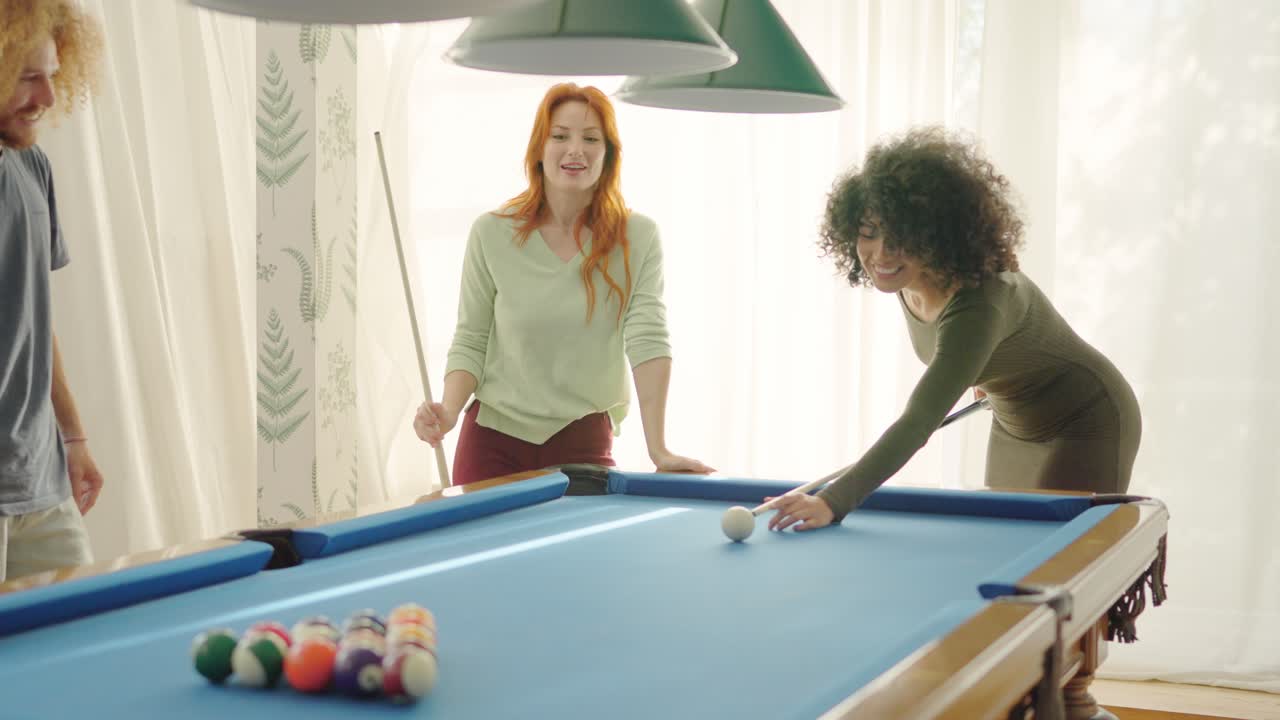 Friends starting to play pool at home