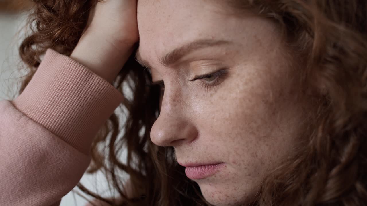 Close up of thoughtful young caucasian woman