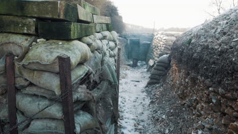 a first world war trench view with wooden planks and sand bags in france during ww1