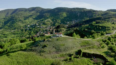 aerial view showing church in top of rhodope mountains during sunny day , bulgaria