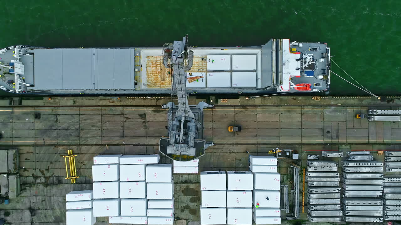 Top down view of a big ship, transportation on the sea, watiting for loading container and cargo, slow motion and copy space