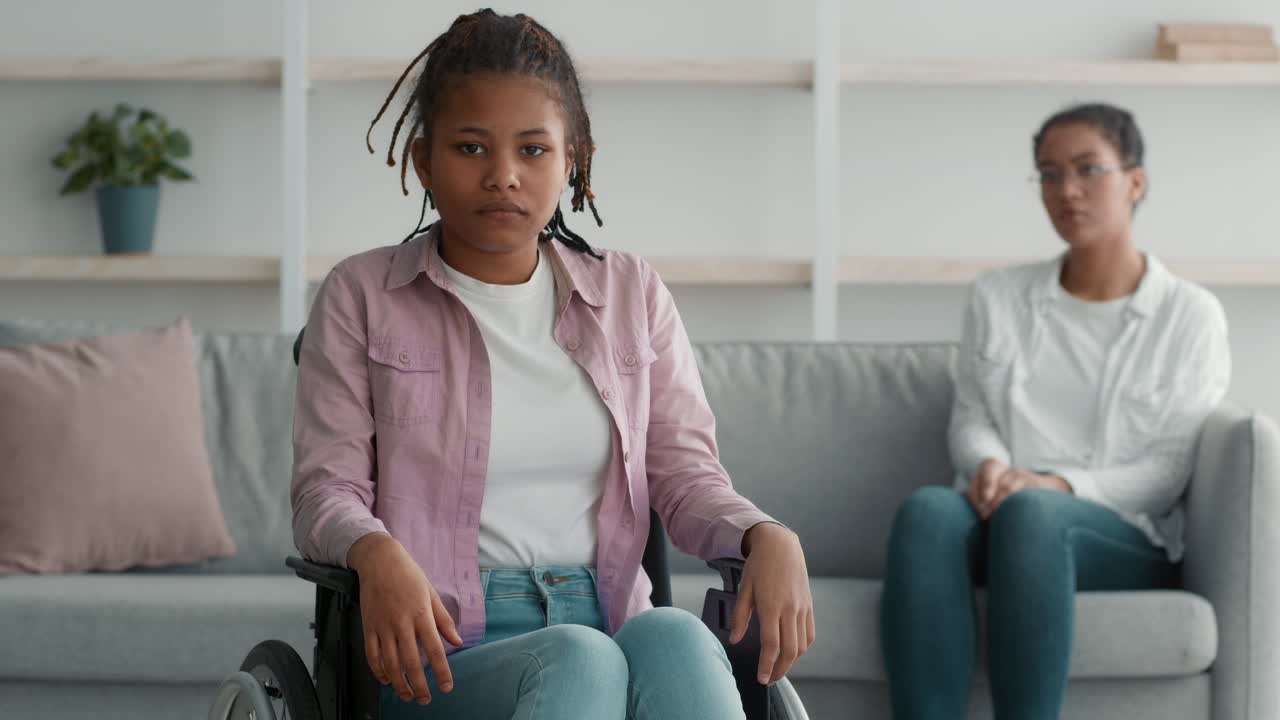 Teenager in Wheelchair with Adult
