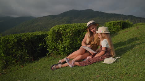 mother and daughter enjoying a peaceful day at a tea plantation