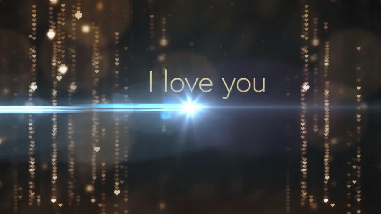 I love you text animation over sparkling golden lights and lens flare