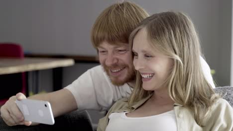 smiling young couple having video call