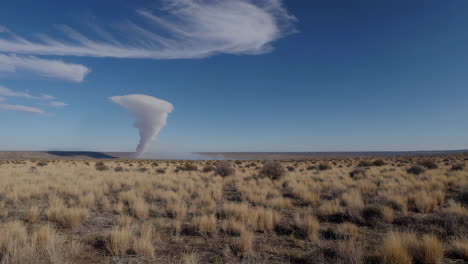 desert landscape with smoke plume