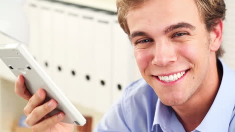 young man using calculator