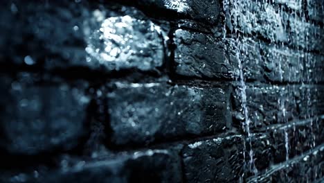 a black brick wall with water droplets on it