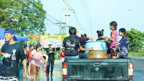 people joyfully engaging in a water fight