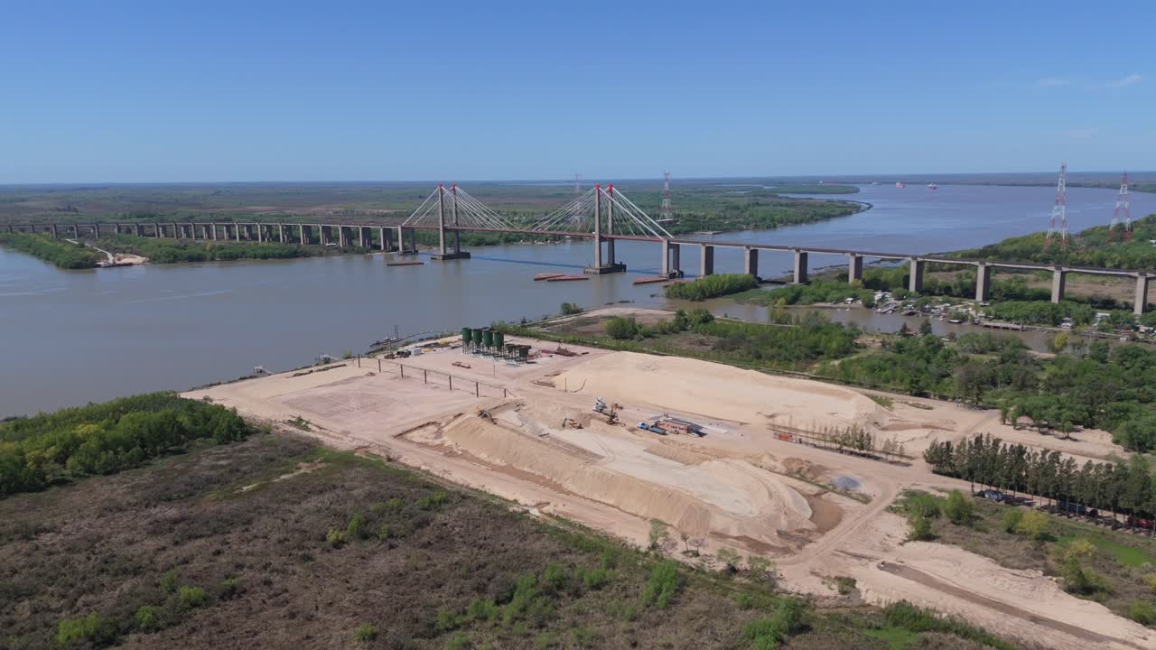 Aerial view of the majestic justo jose de urquiza bridge stretching over the parana guazu river in argentina, one of zarate brazo largo dam bridges