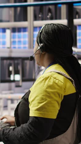 Vertical video Smart factory specialist using headset mic to communicate insights to engineers
