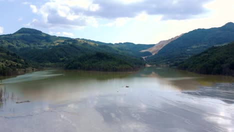 Sunken-Village-Of-Geamana-In-A-Toxic-Lake-Surrounded-With-Apuseni-Mountains-In-Romania