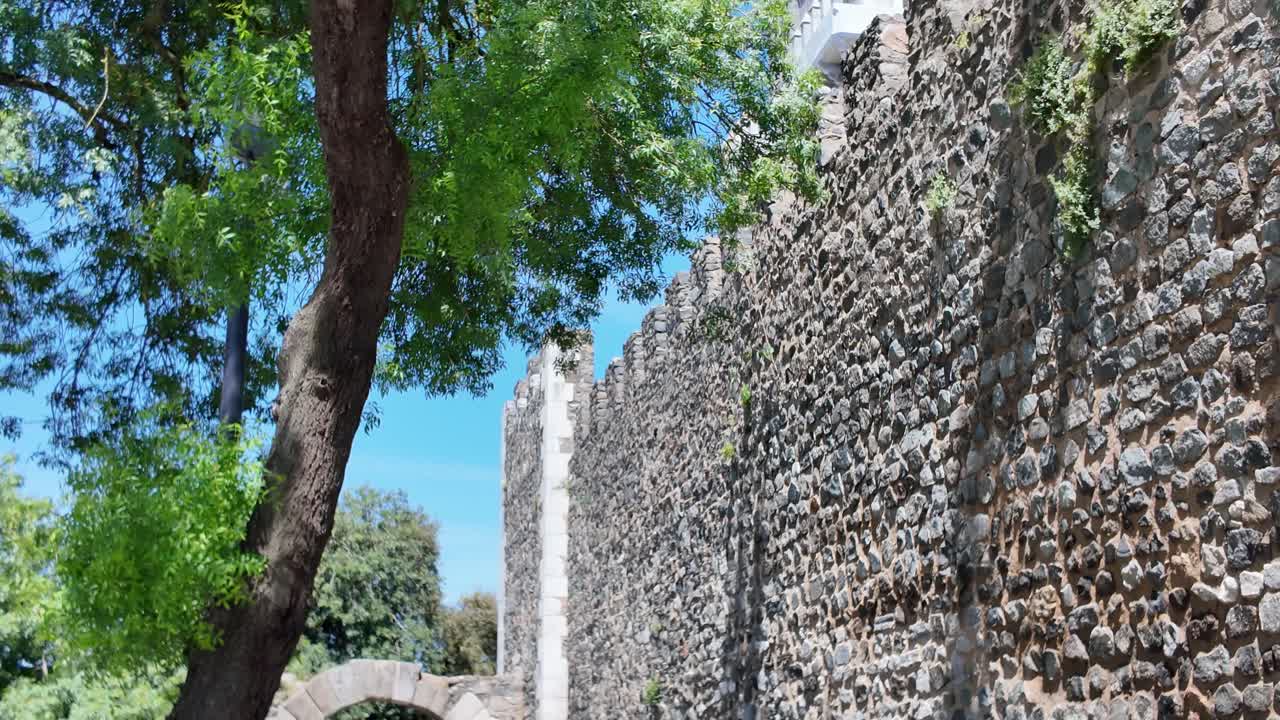 Historic stone walls of Beja Castle in Portugal, under bright sunshine