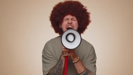 smiling bearded man talking with megaphone, proclaiming news, loudly announcing sale advertisement