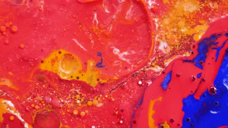 abstract fluid art with red, blue, and yellow