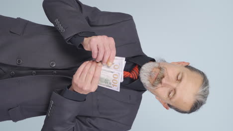 Vertical-video-of-Rich-old-businessman-counting-money.