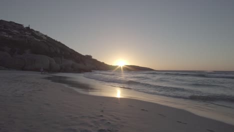 sunset on llandudno beach in cape town, south africa, in slow motion