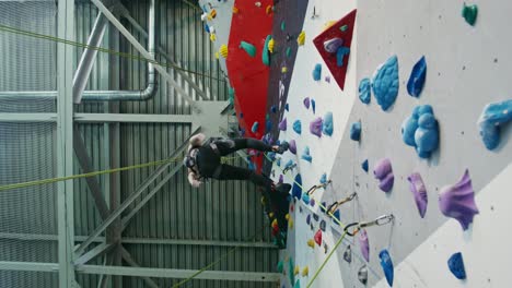 woman rock climbing indoor