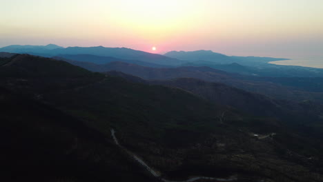 a drone high altitude aerial of a mountain road at sunset in pico de los reales, estepona, spain