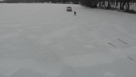 boy pulled by a truck on snow