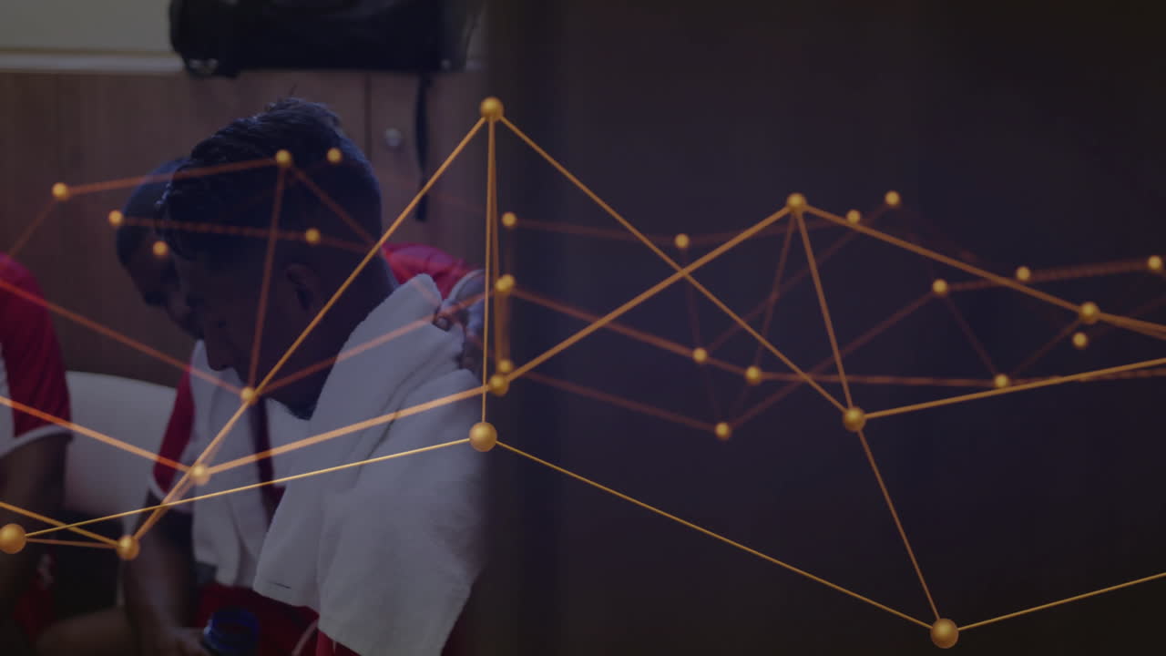 Three male athletes sitting on bench, viewing sports analytics via glowing network overlay