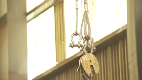 shipyard. a worker operates a large crane