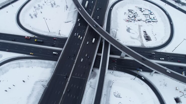 Aerial view of a freeway intersection Snow-covered in winter.