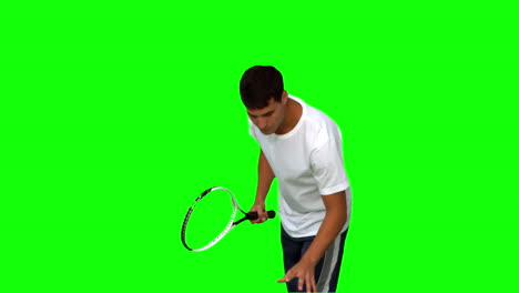 Mann-Hält-Einen-Tennisball-Und-Einen-Schläger-Auf-Einem-Greenscreen