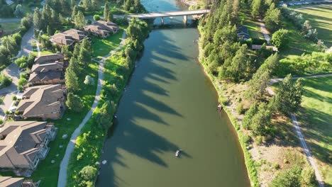 Houses-And-Bridge-By-The-Clark-Fork-River-On-A-Sunny-Day-In-Missoula,-Montana,-USA