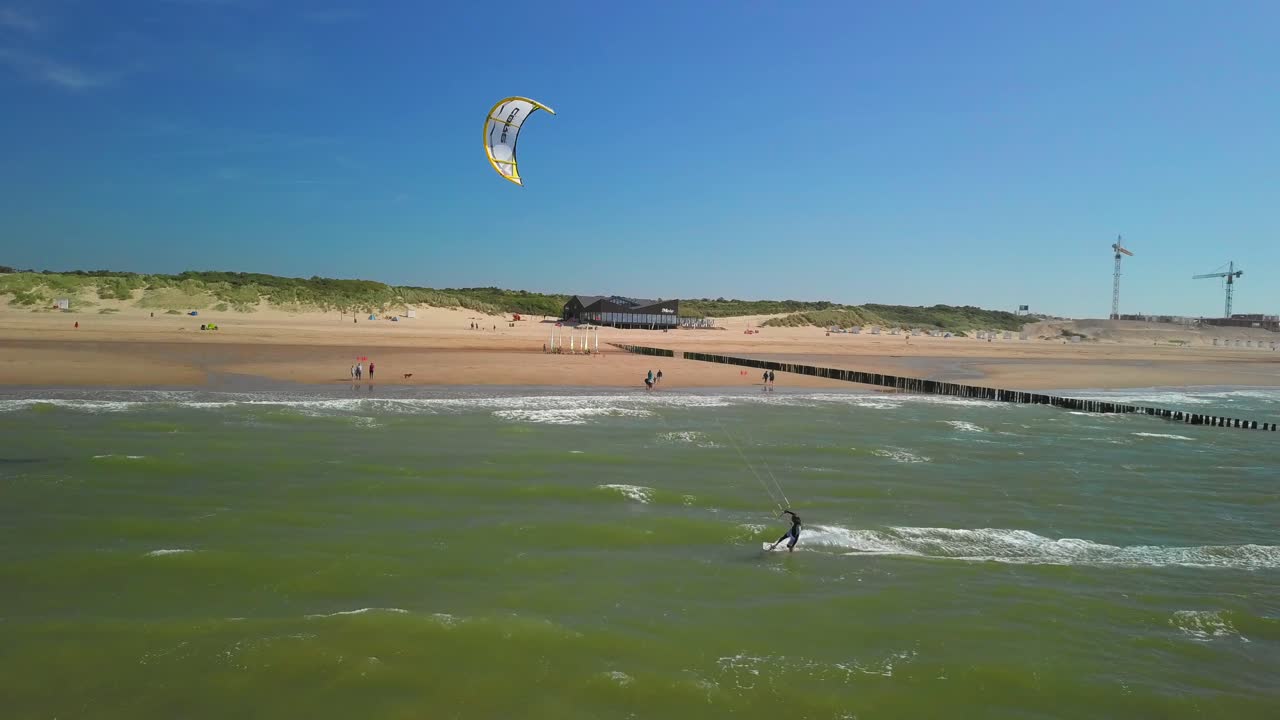 Kitesurfer at the beach of Cadzand during a sunny day. Aerial shot
